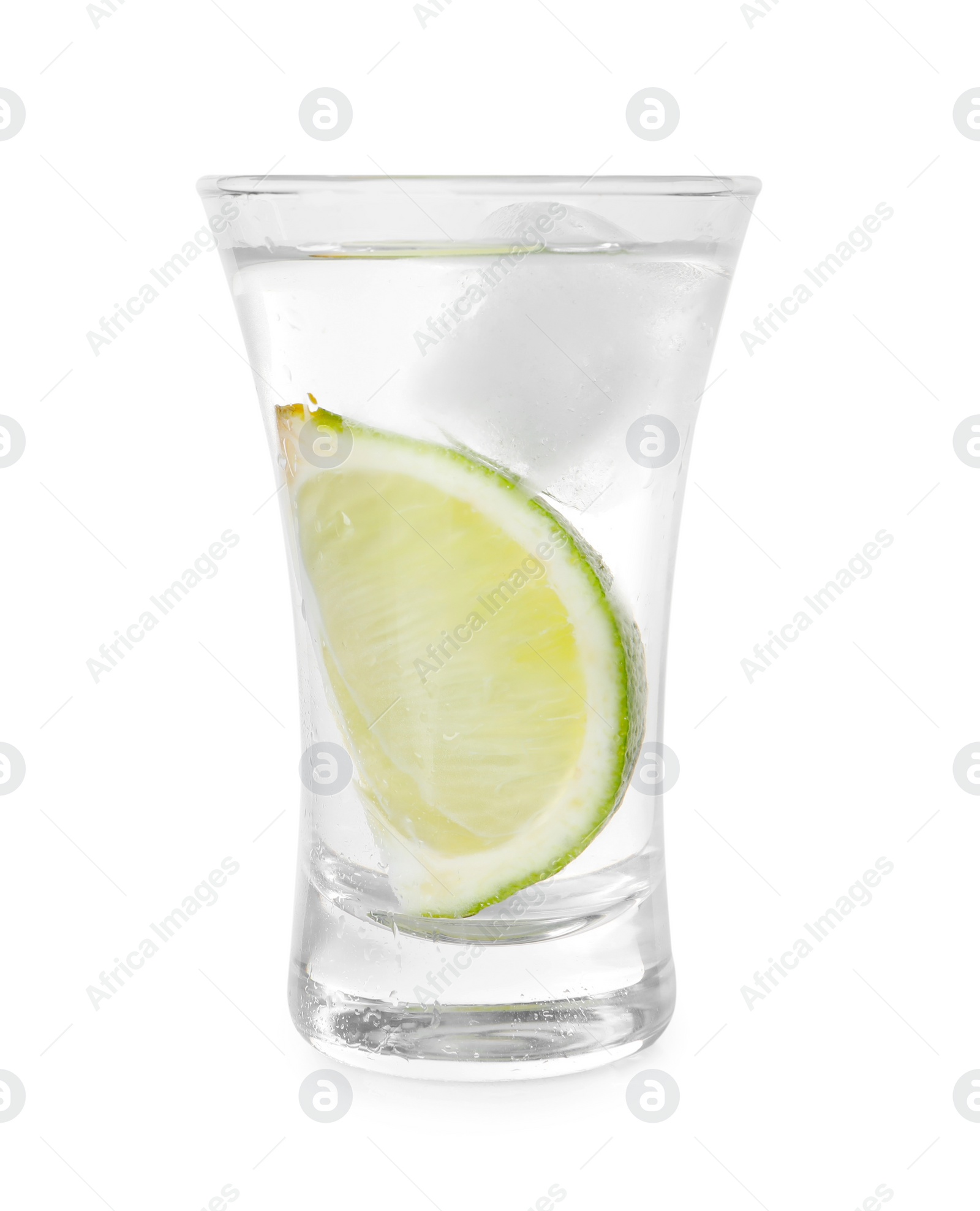 Photo of Glass of vodka with lime and ice isolated on white