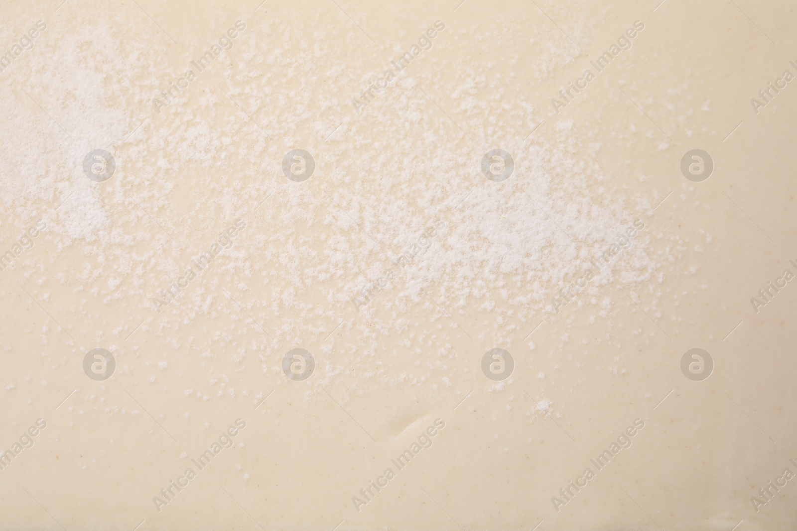 Photo of Raw puff pastry dough as background, top view