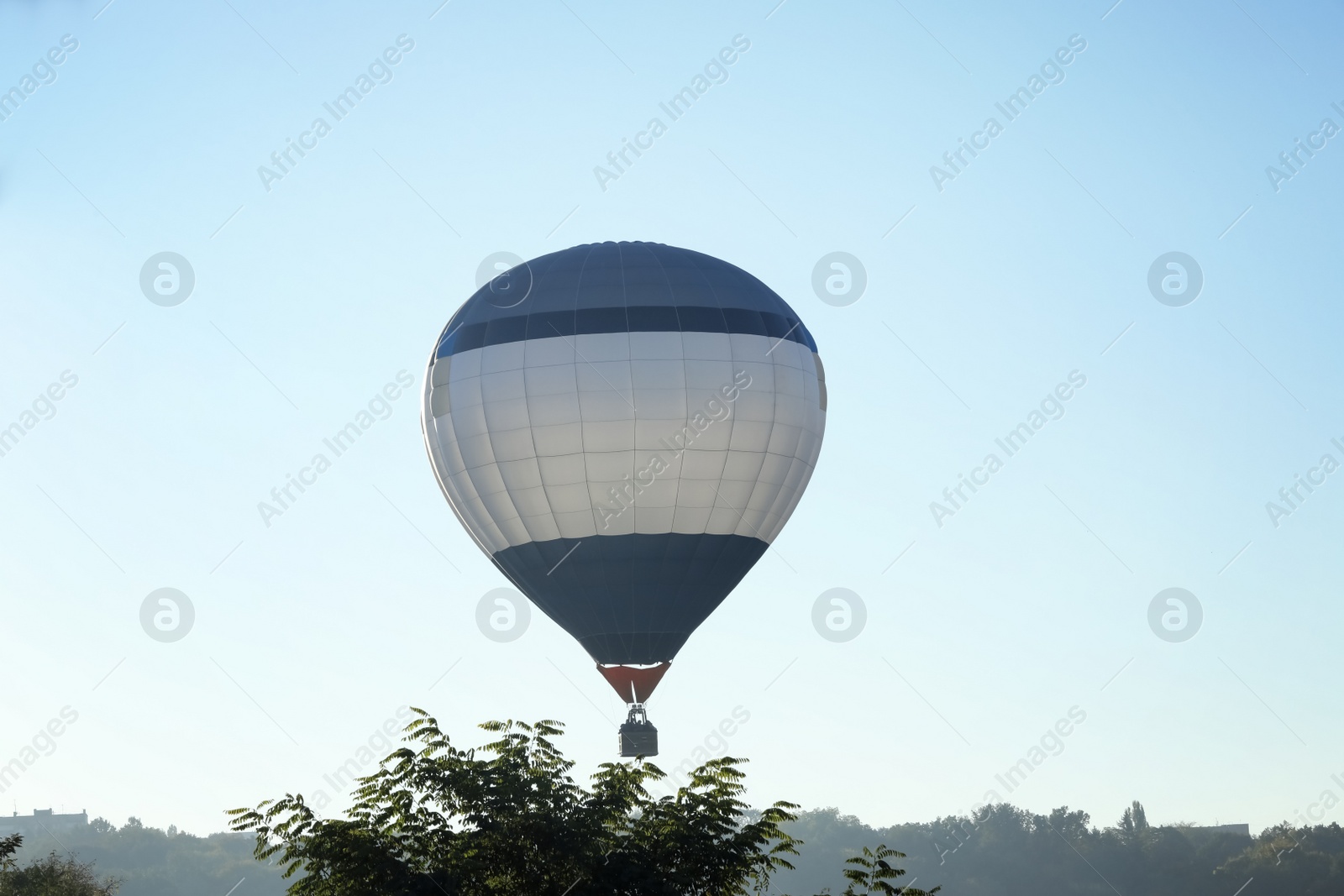 Photo of Beautiful view of hot air balloon flying over countryside