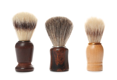 Photo of Shaving brushes for men on white background