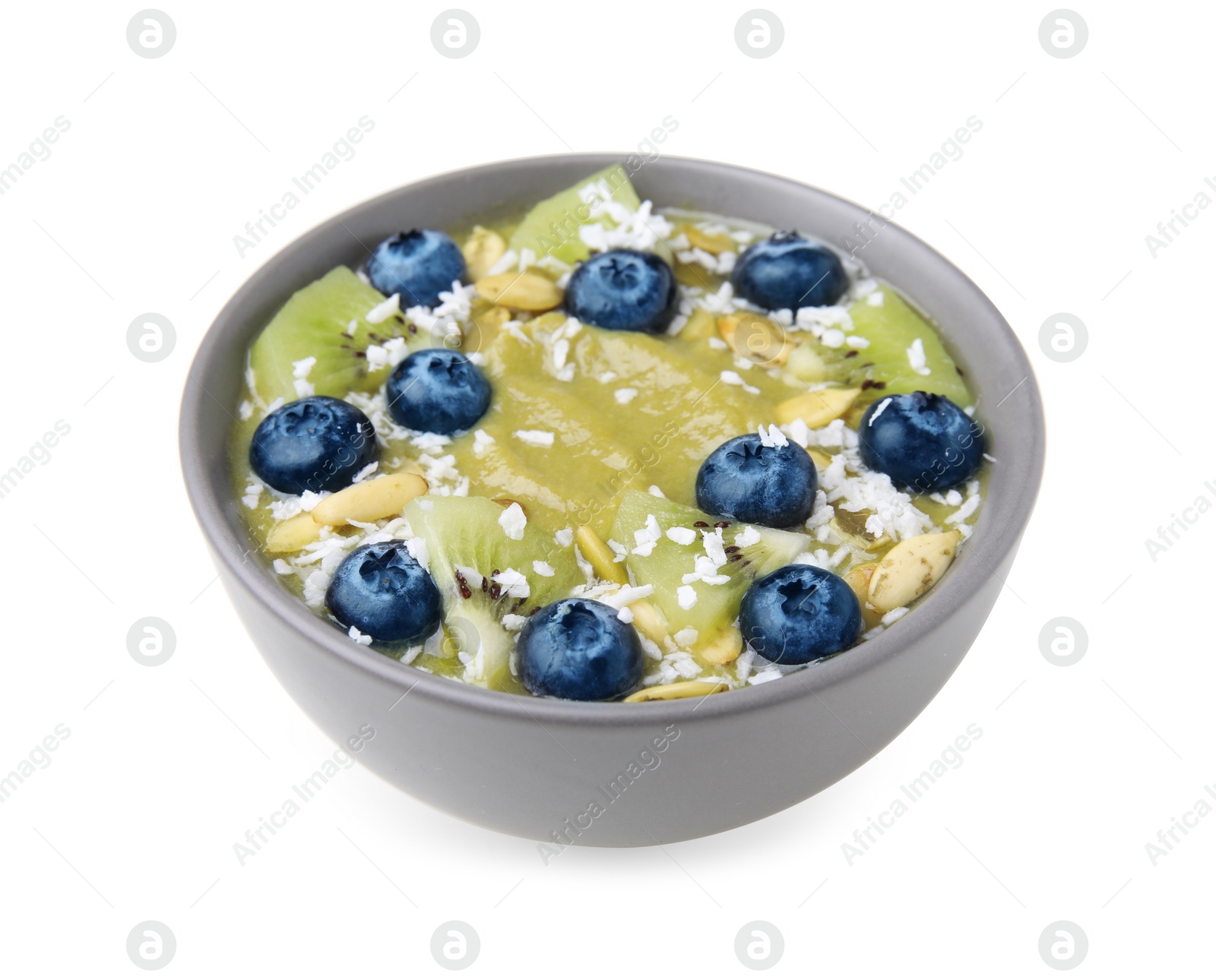 Photo of Bowl of delicious fruit smoothie with fresh blueberries, kiwi slices and coconut flakes isolated on white