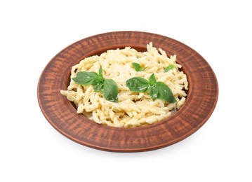 Photo of Plate of delicious trofie pasta with cheese and basil leaves isolated on white