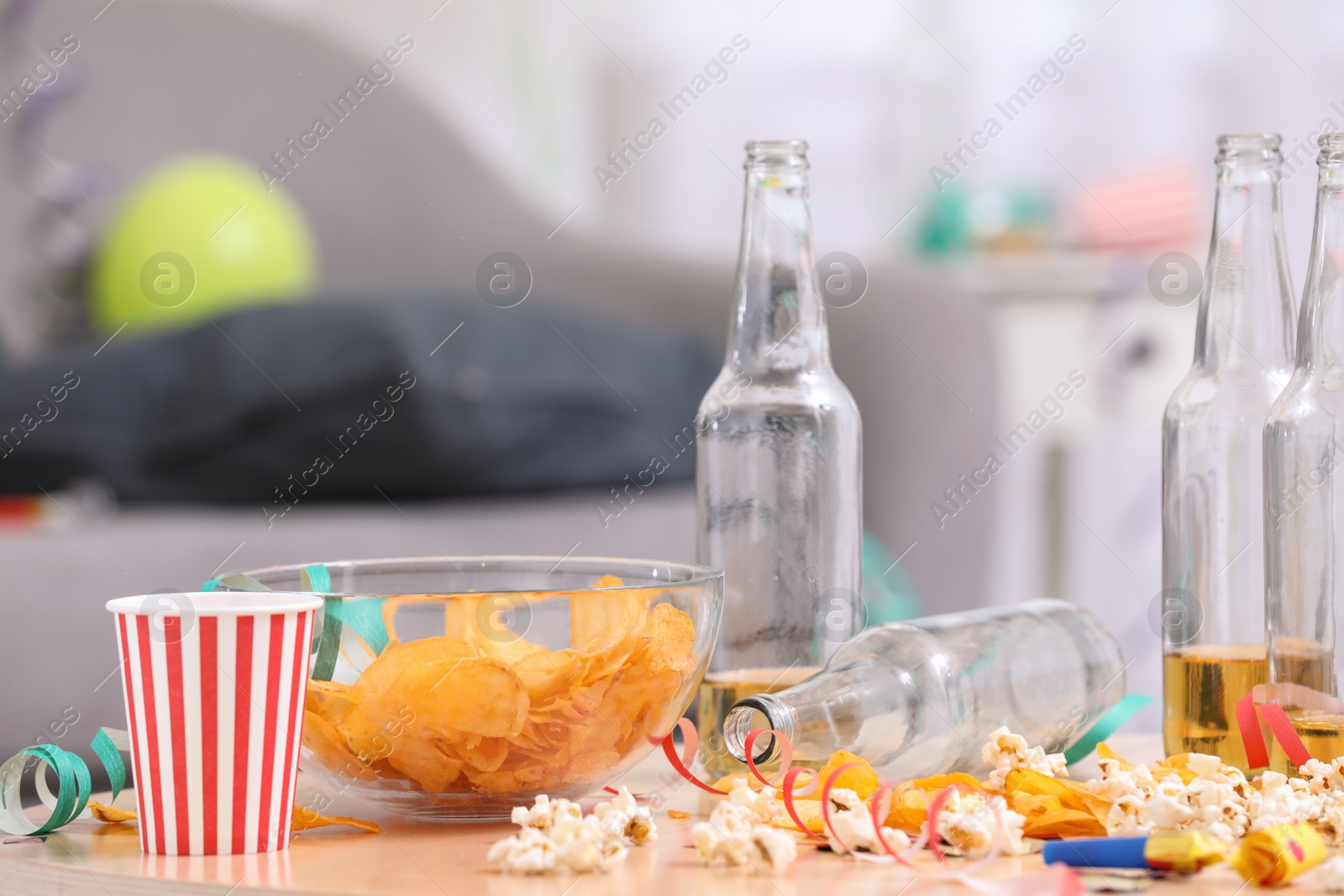 Photo of Wooden table with mess after party indoors