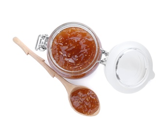 Photo of Jar and spoon with homemade delicious fig jam on white background, top view