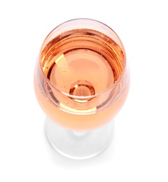 Photo of Glass of rose champagne on white background. Festive drink