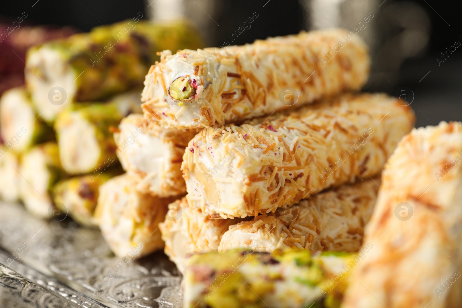 Photo of Turkish delight dessert on tray, closeup. Traditional sweet