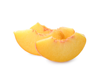Photo of Slices of ripe peach on white background