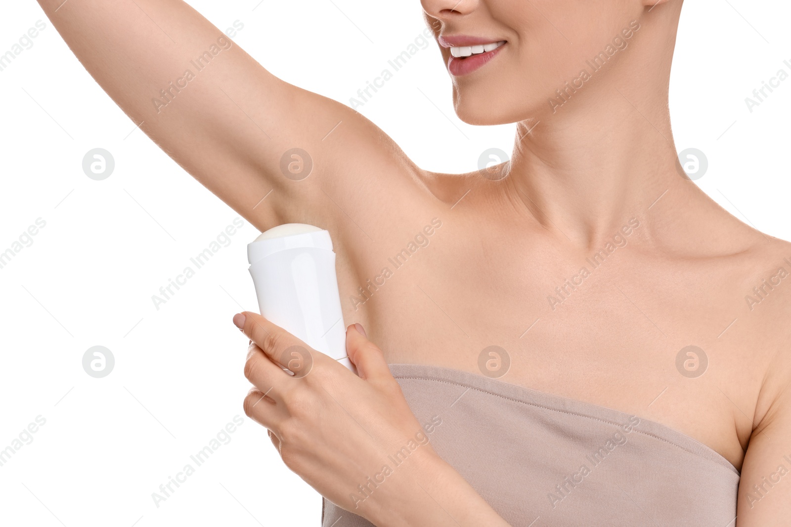 Photo of Woman applying deodorant on white background, closeup