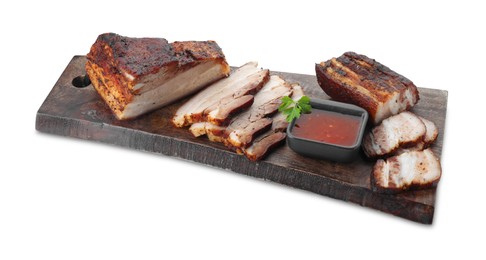 Photo of Pieces of tasty baked pork belly and sauce isolated on white