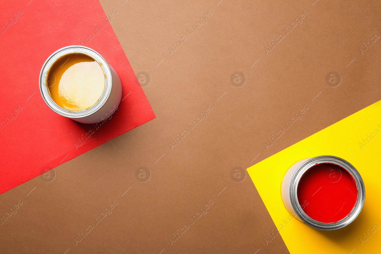 Photo of Flat lay composition with paint cans and space for text on color background