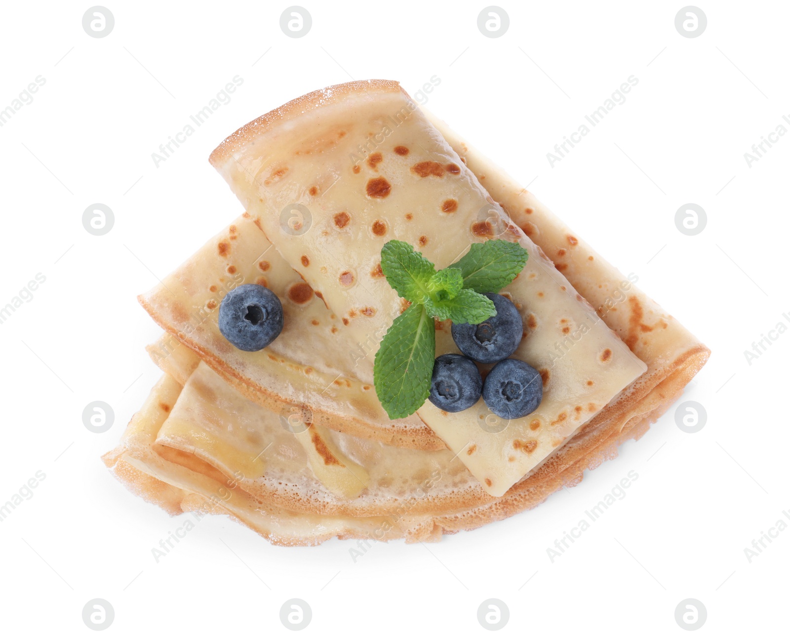 Photo of Delicious crepes with blueberries and mint on white background, top view