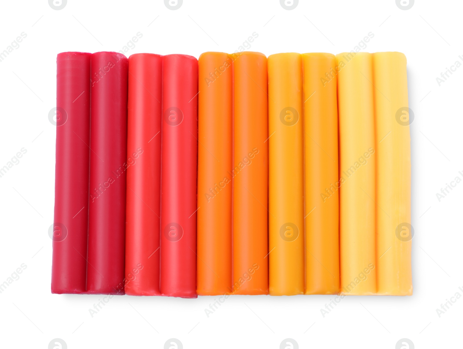 Photo of Many different colorful plasticine pieces on white background, top view