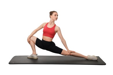 Photo of Yoga workout. Young woman stretching on white background