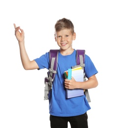 Cute boy with school stationery on white background
