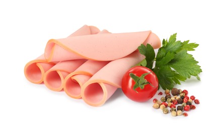 Slices of delicious boiled sausage with parsley, tomato and pepper on white background