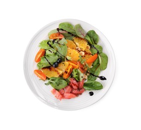 Photo of Delicious salad with salmon isolated on white, top view