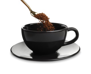 Photo of Pouring aromatic instant coffee into black cup on white background