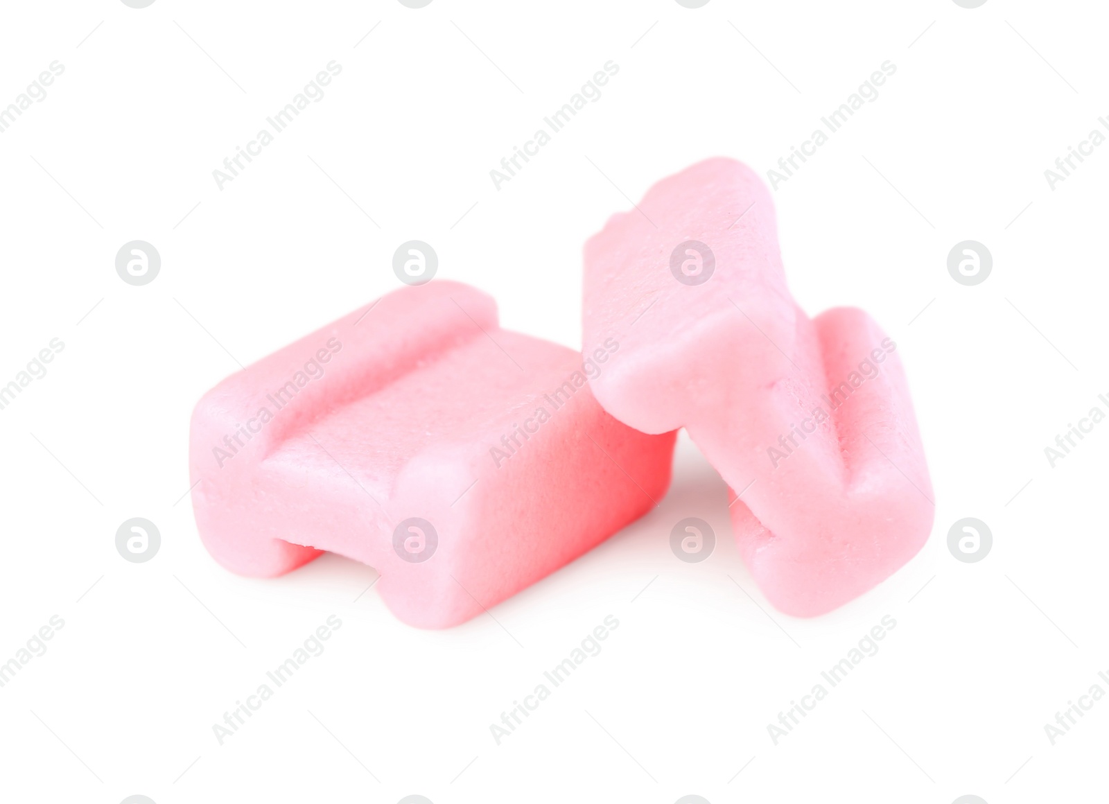 Photo of Tasty pink chewing gums isolated on white