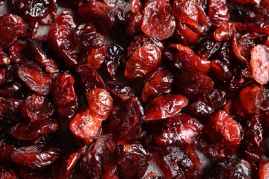 Photo of Heap of sweet cranberries, closeup view. Dried fruit as healthy snack