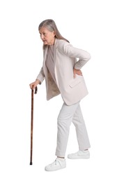 Photo of Senior woman with walking cane suffering from back pain on white background