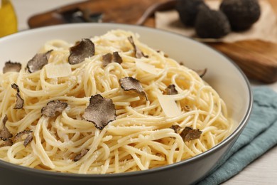Photo of Tasty spaghetti with truffle on table, closeup