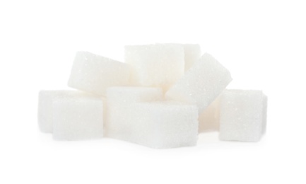 Photo of Heap of refined sugar cubes on white background