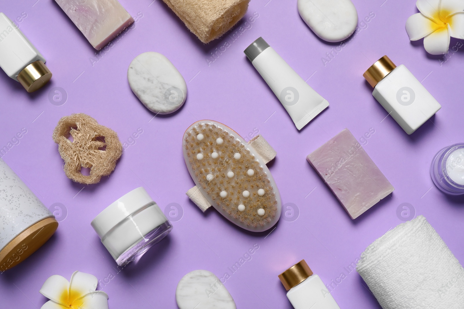 Photo of Spa essentials on violet background, flat lay