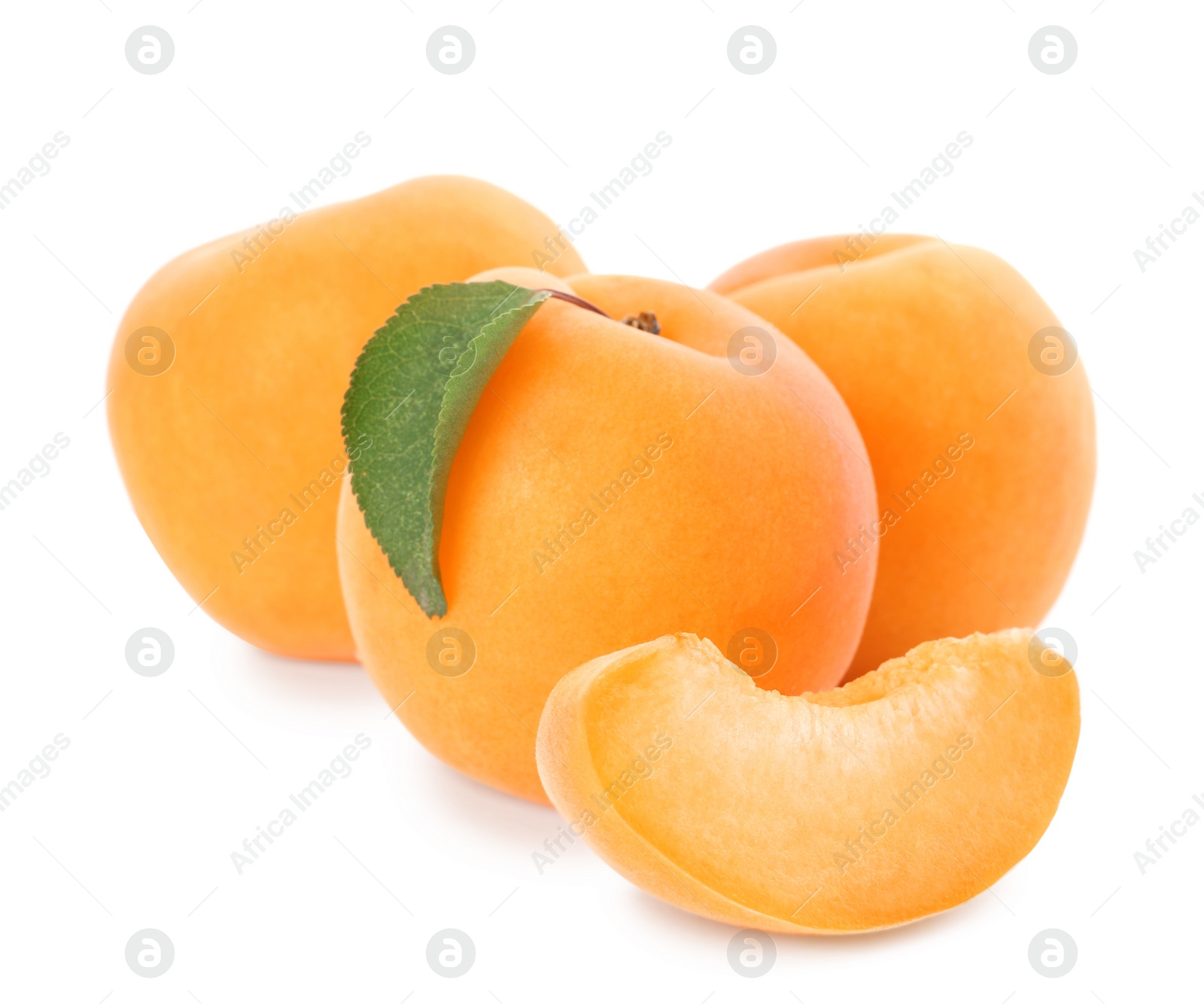 Photo of Delicious ripe apricots with slice isolated on white