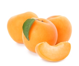 Delicious ripe apricots with slice isolated on white