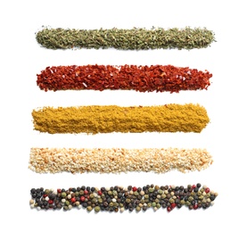 Rows of different aromatic spices on white background, top view with space for text