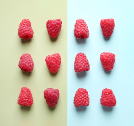 Photo of Flat lay composition with delicious ripe raspberries on color background