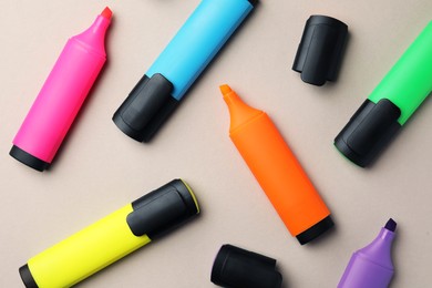 Photo of Bright color markers on light grey background, flat lay