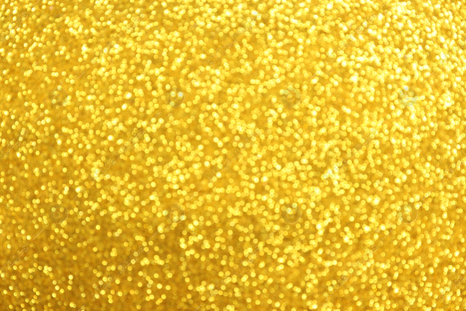 Photo of Beautiful golden shiny glitter as background, top view
