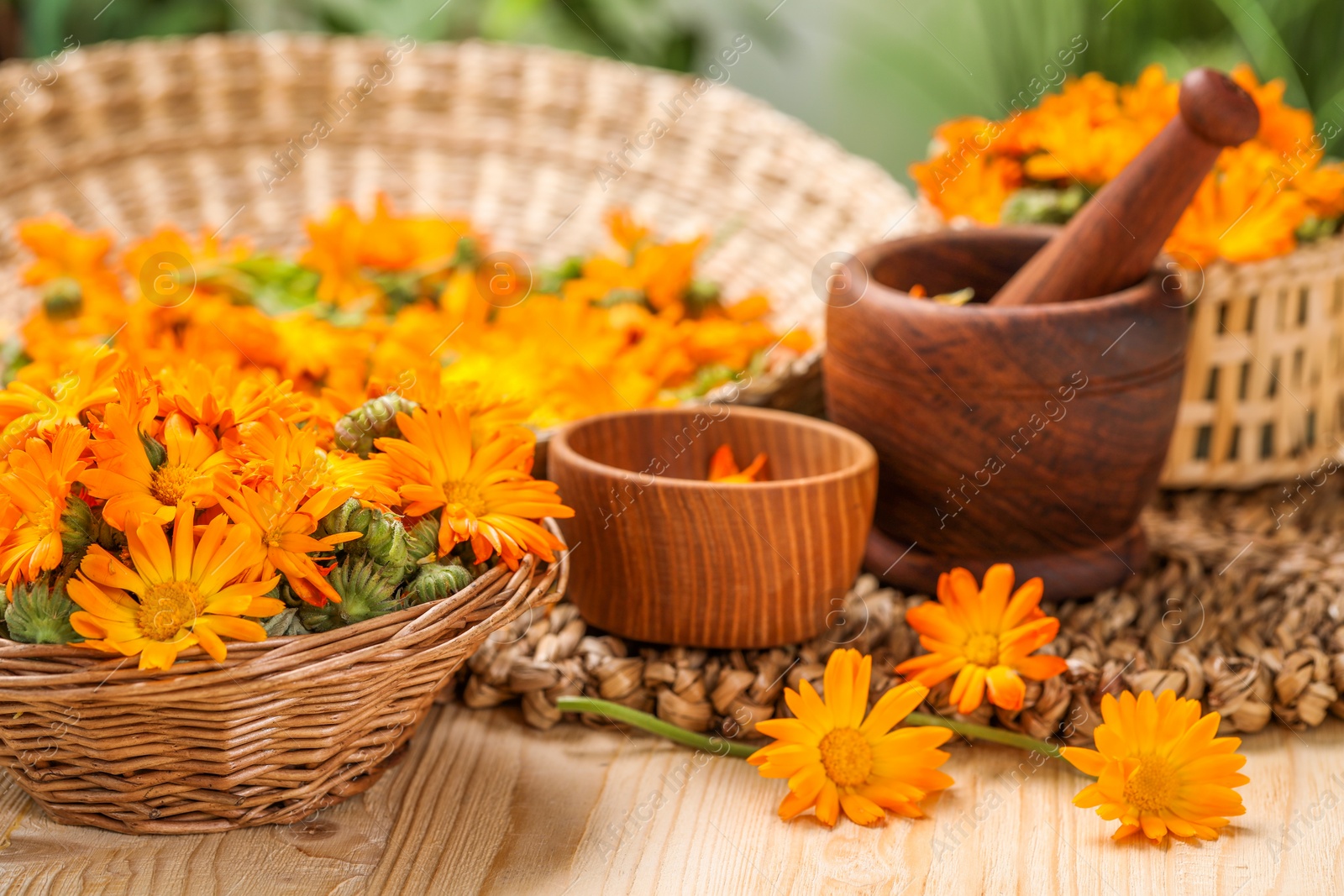 Photo of Many beautiful fresh calendula flowers on table