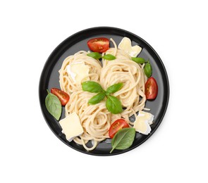 Photo of Delicious pasta with brie cheese, tomatoes and basil leaves isolated on white, top view
