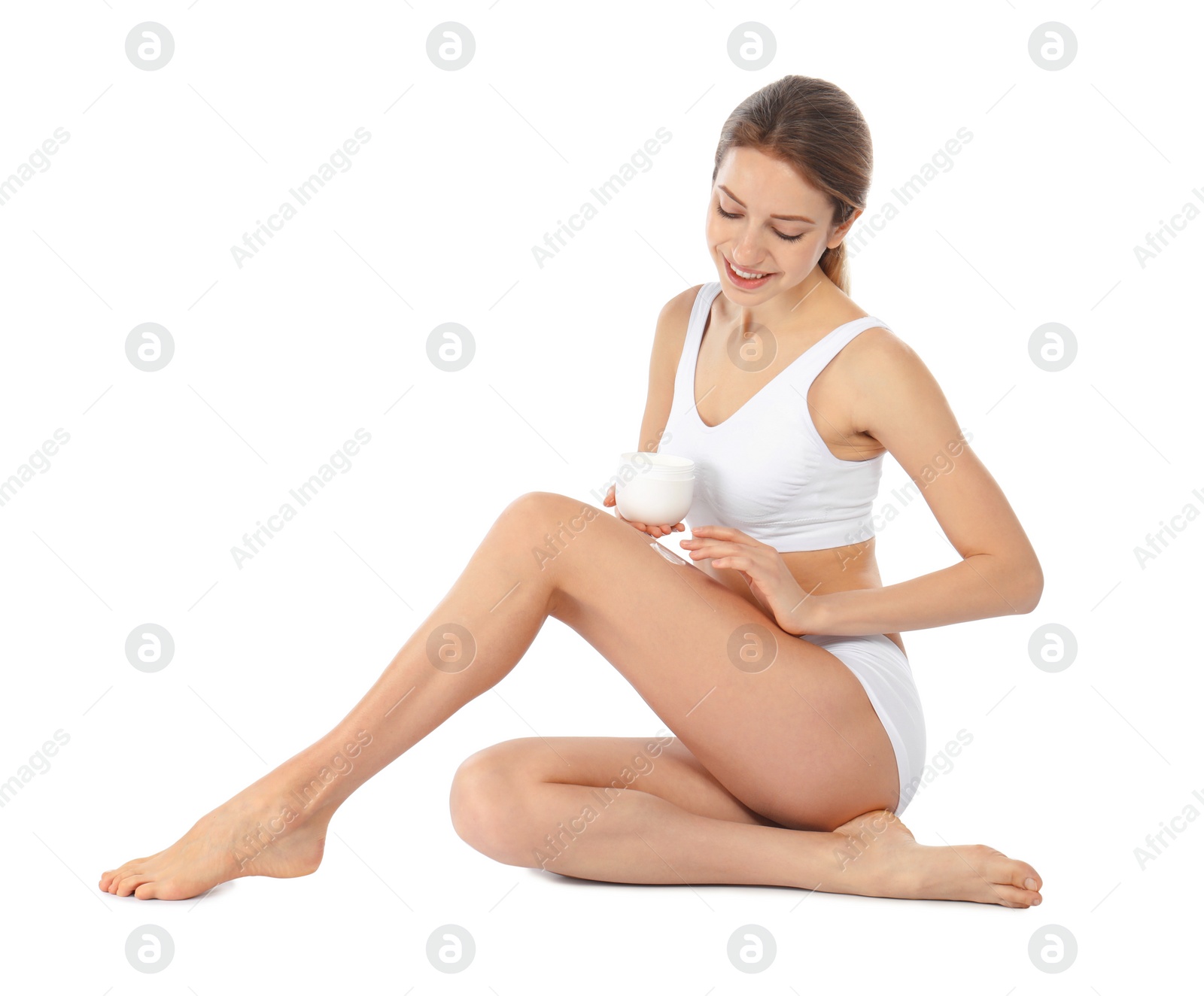 Photo of Young woman with jar of cream on white background. Beauty and body care