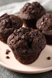 Photo of Delicious fresh chocolate muffins on table, closeup
