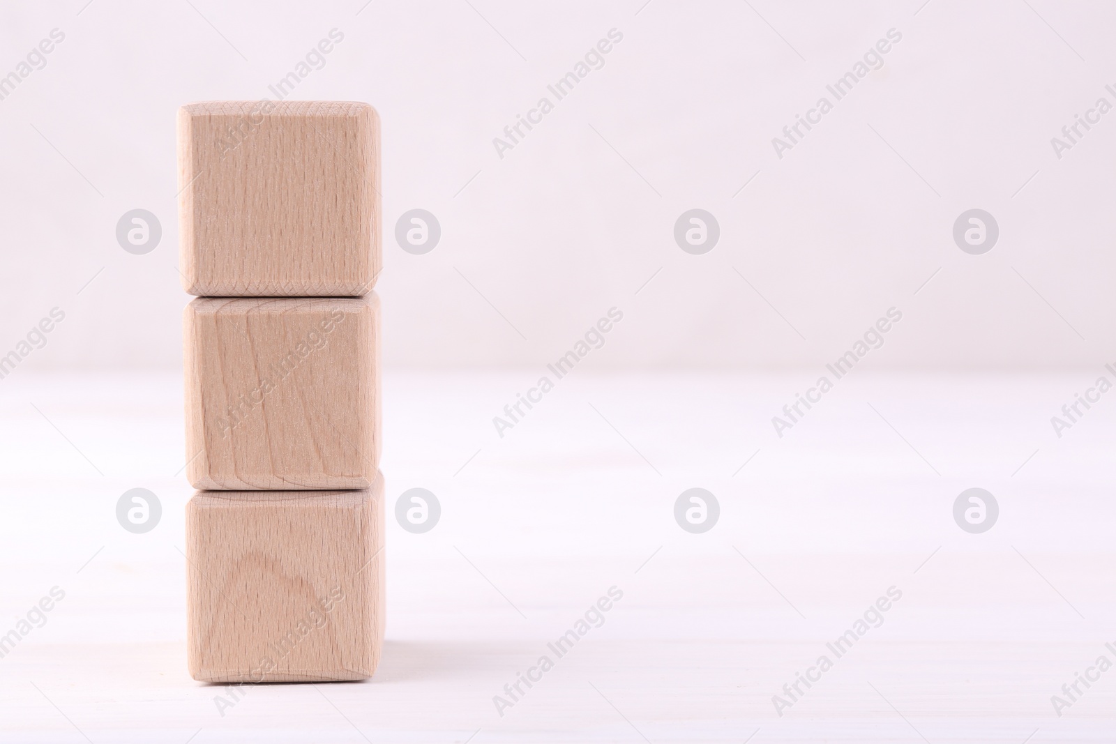 Photo of International Organization for Standardization. Wooden cubes with abbreviation ISO on white table, space for text