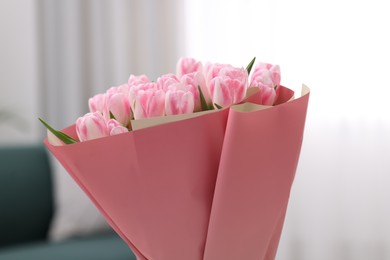 Beautiful bouquet of fresh pink tulips at home, closeup