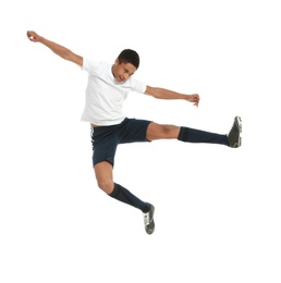 Teenage African-American boy playing football on white background