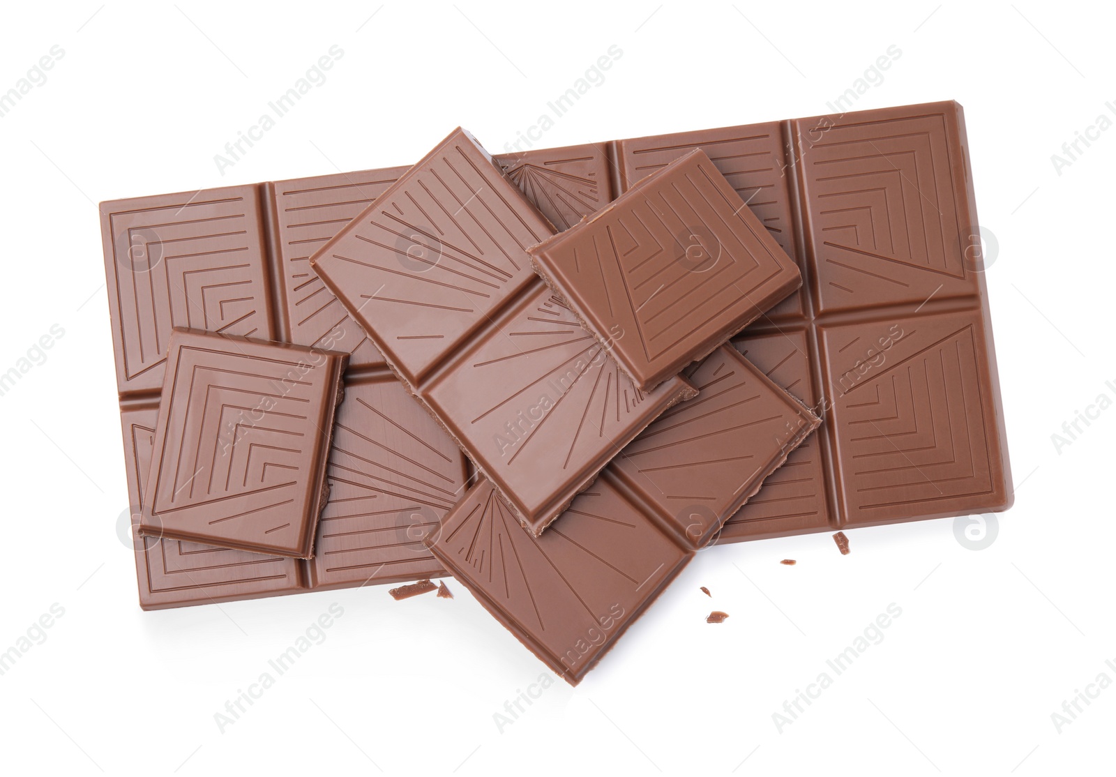 Photo of Broken milk chocolate bar on white background, top view