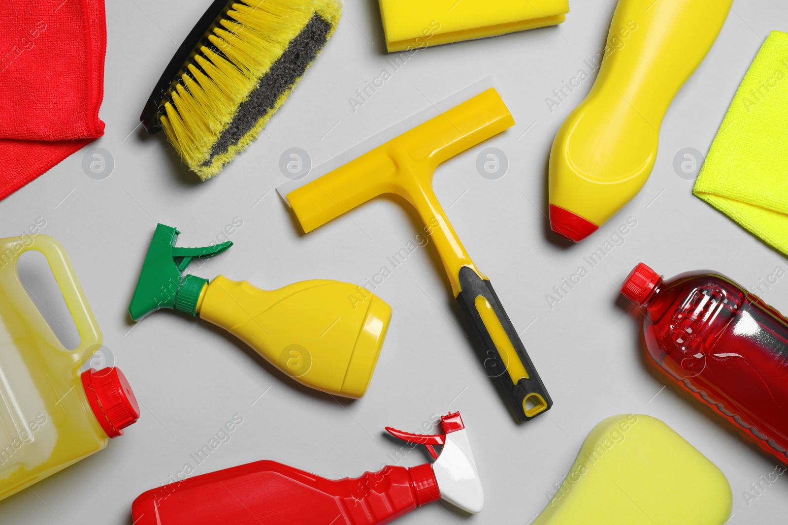 Photo of Different car products on light grey background, flat lay