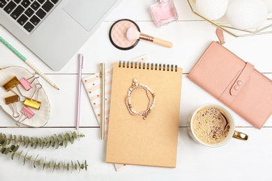 Set of accessories, cosmetics and laptop on wooden background, flat lay. Beauty blogging
