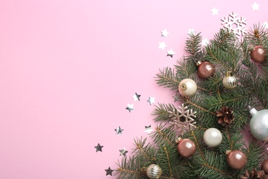 Photo of Flat lay composition with Christmas decor on light pink background. Space for text