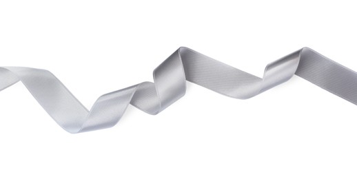 Photo of Silver satin ribbon on white background, top view