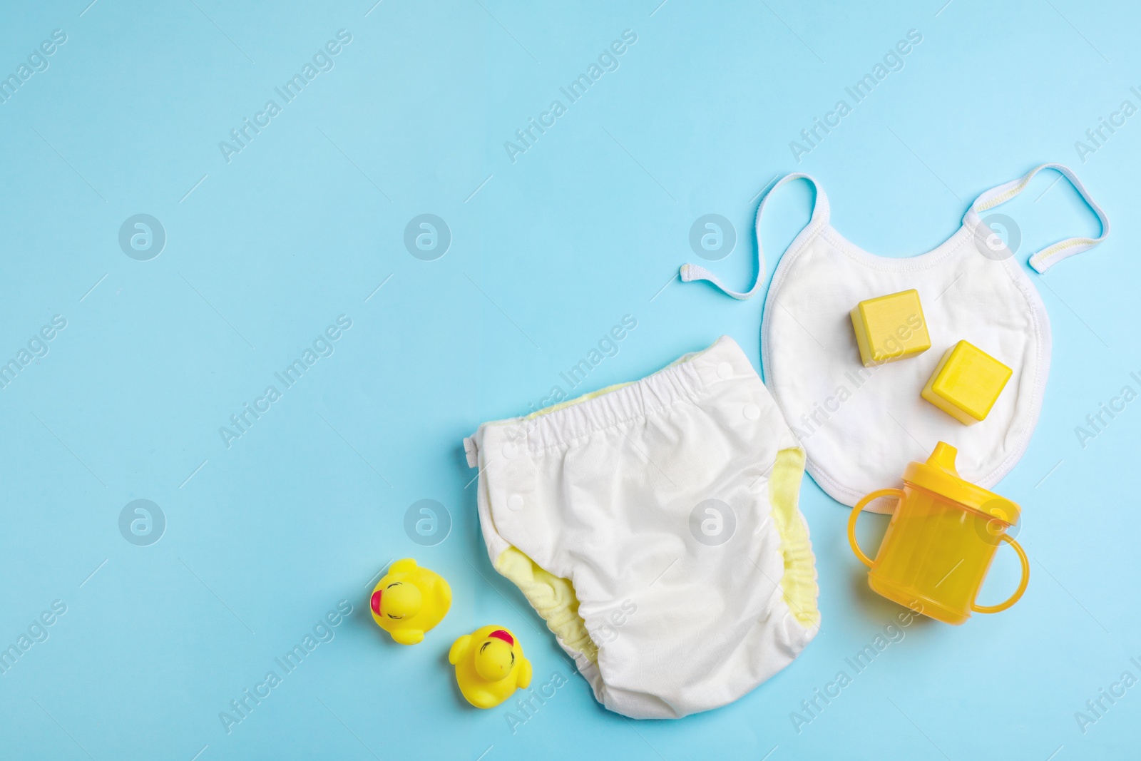 Photo of Flat lay composition with baby accessories on color background. Space for text