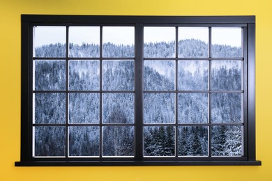 Image of Beautiful view of snowy mountain landscape through window