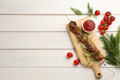 Photo of Metal skewer with delicious meat and vegetables served on white wooden table, flat lay. Space for text