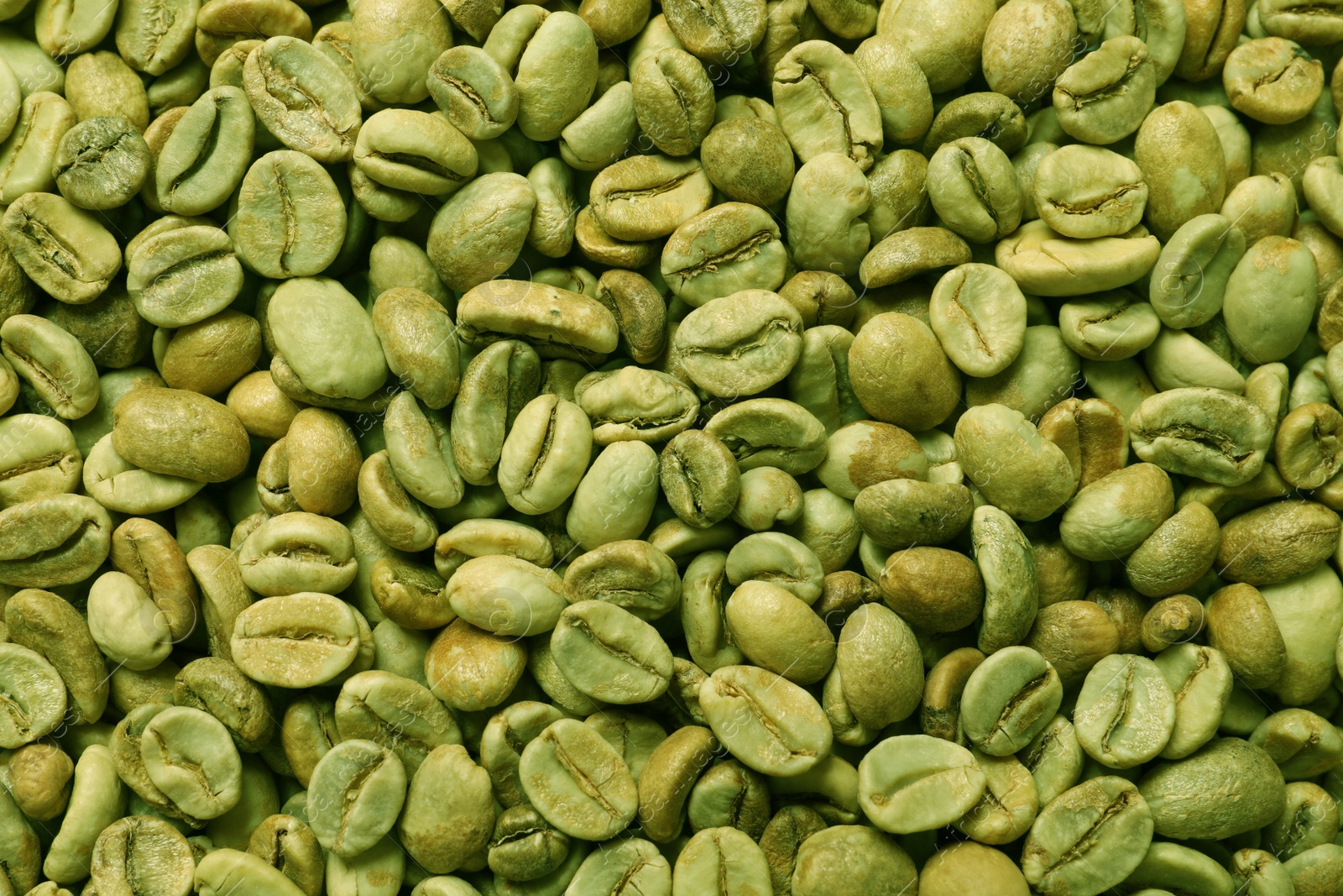 Photo of Many green coffee beans as background, top view