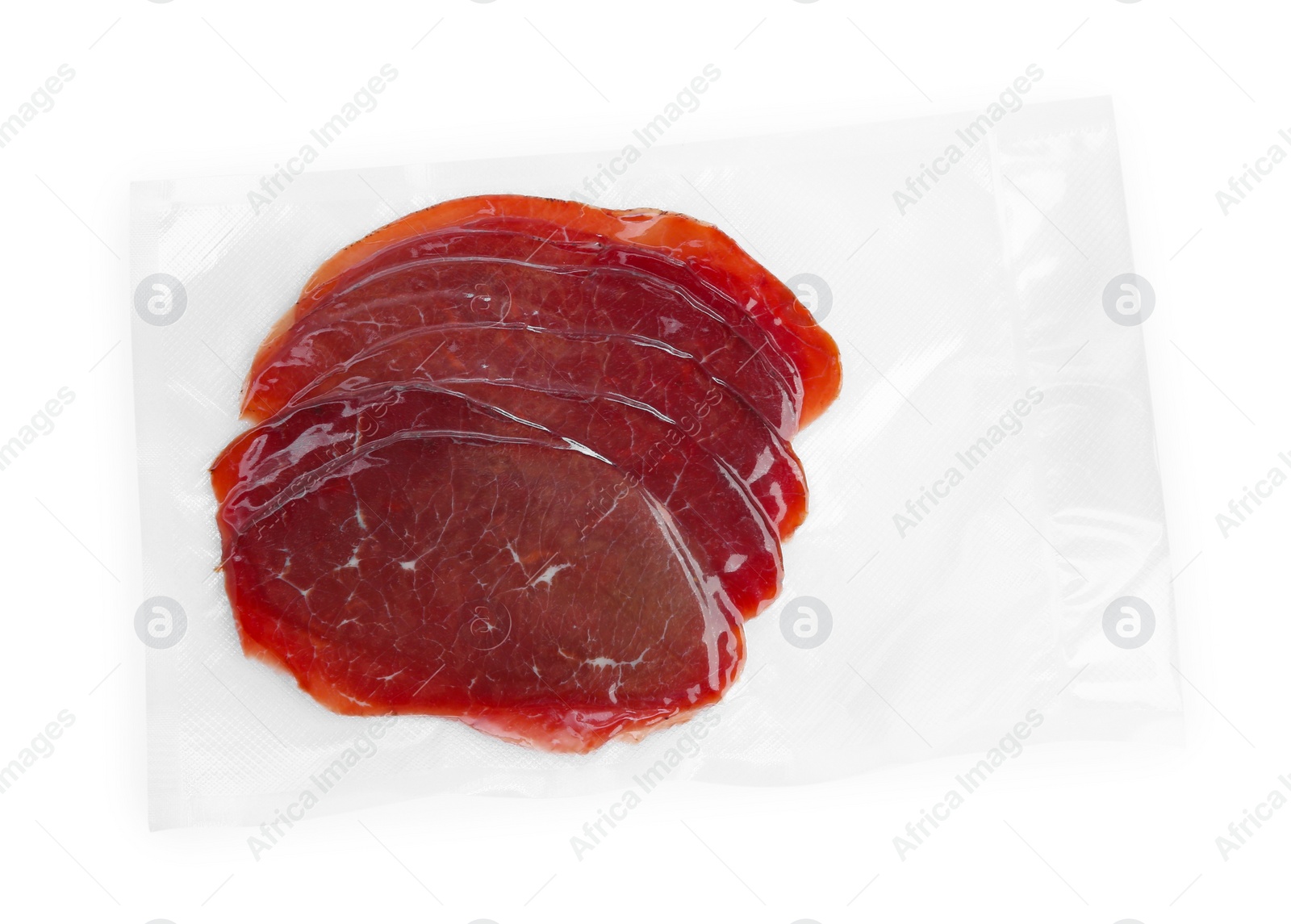 Photo of Slices of tasty bresaola isolated on white, top view